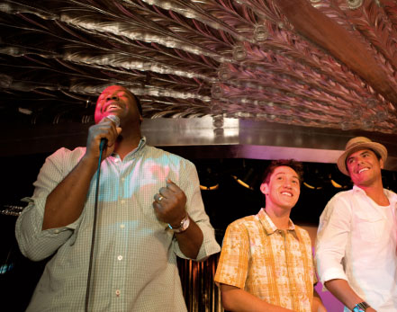 Man with microphone performing karaoke.