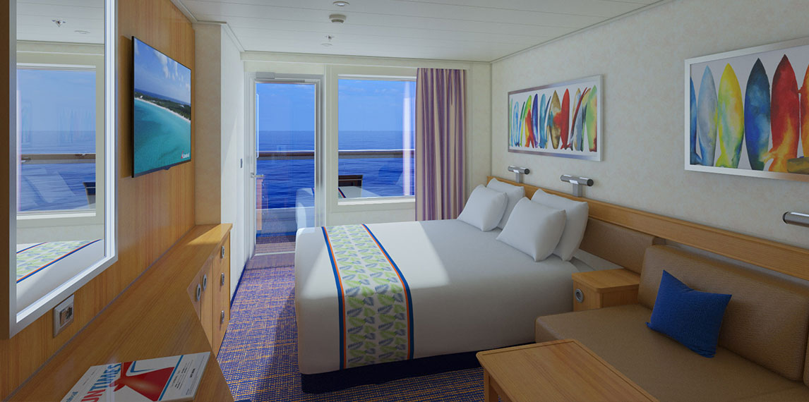 Stateroom with balcony that overlooks the ocean.
