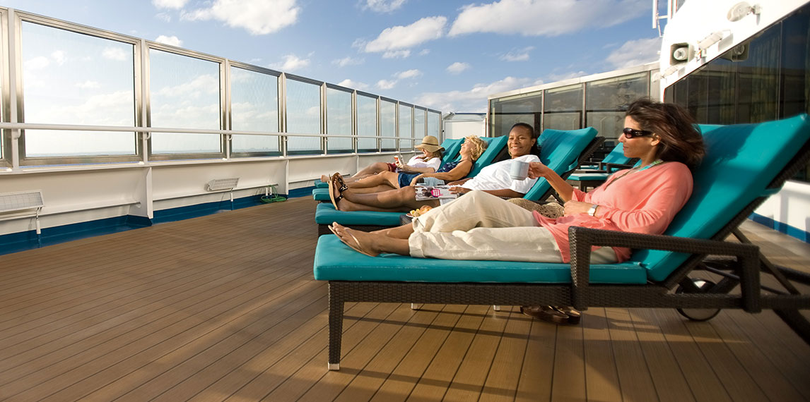 Group of friends sitting on deck relaxing.