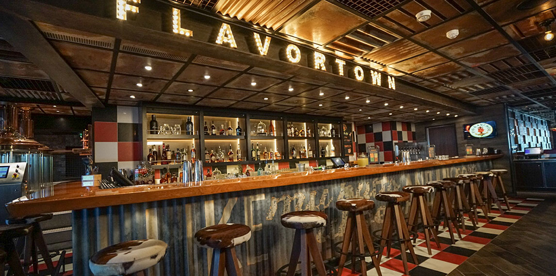 Side view of bar and bar stools of Guy's Pig and Anchor smoke house.