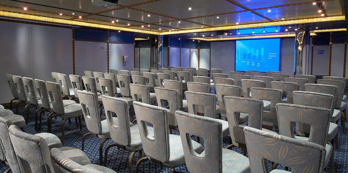 Conference room with projector and seating.