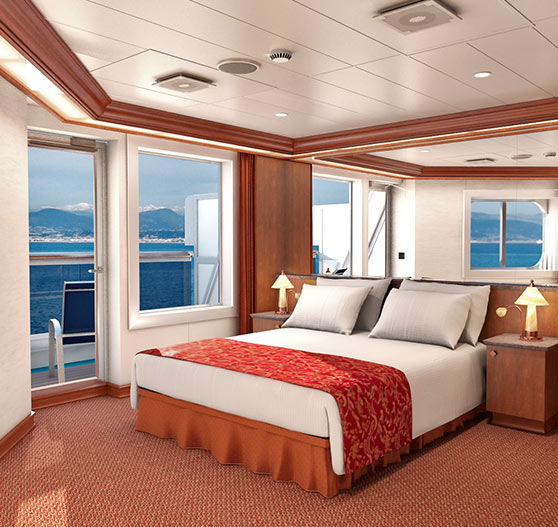 Junior suite stateroom interior on Carnival Liberty.