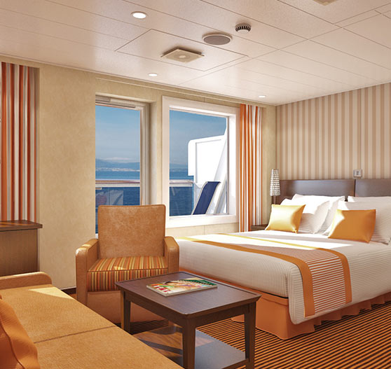 Junior suite stateroom interior on carnival valor.