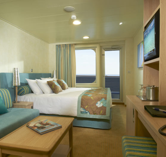 Interior of a balcony view stateroom on Carnival Breeze.