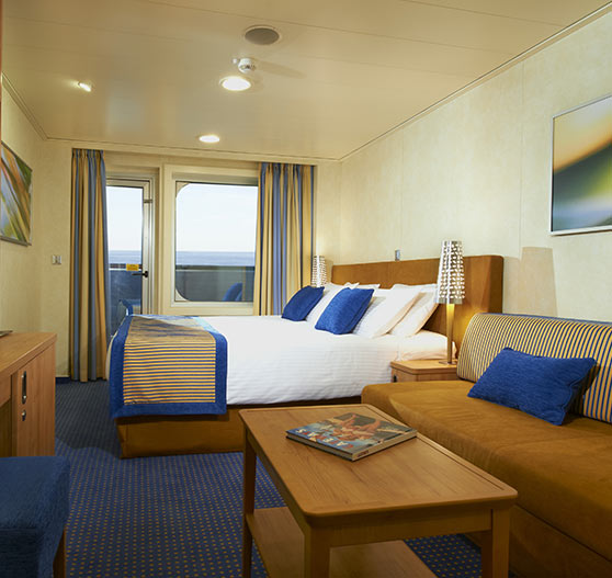 Interior of a balcony view stateroom on Carnival Breeze.