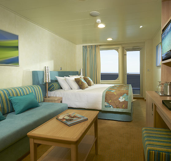 Interior of a balcony view stateroom on Carnival Breeze.