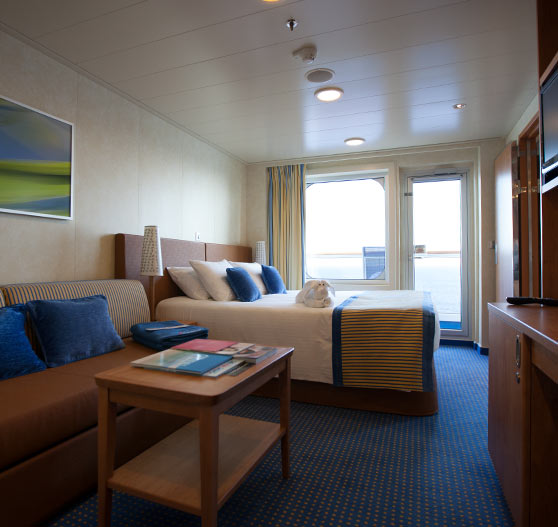 Interior of a balcony view stateroom on Carnival Breeze.