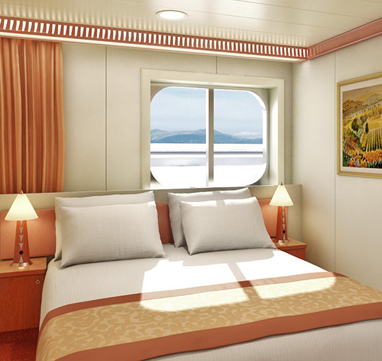 Interior of window view stateroom on Carnival Conquest.