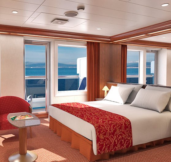 Interior of ocean suite stateroom on Carnival Conquest.