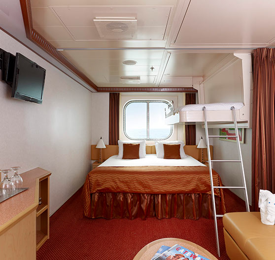 Interior of deluxe bunk-bed stateroom on Carnival Dream.